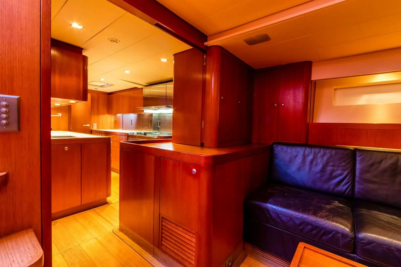 a room with a couch and a counter aboard HOPPETOSSE Yacht for Sale