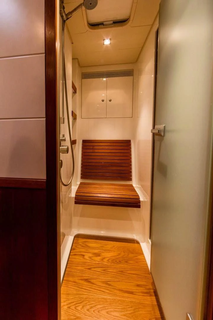 a hallway with a wood door aboard HOPPETOSSE Yacht for Sale