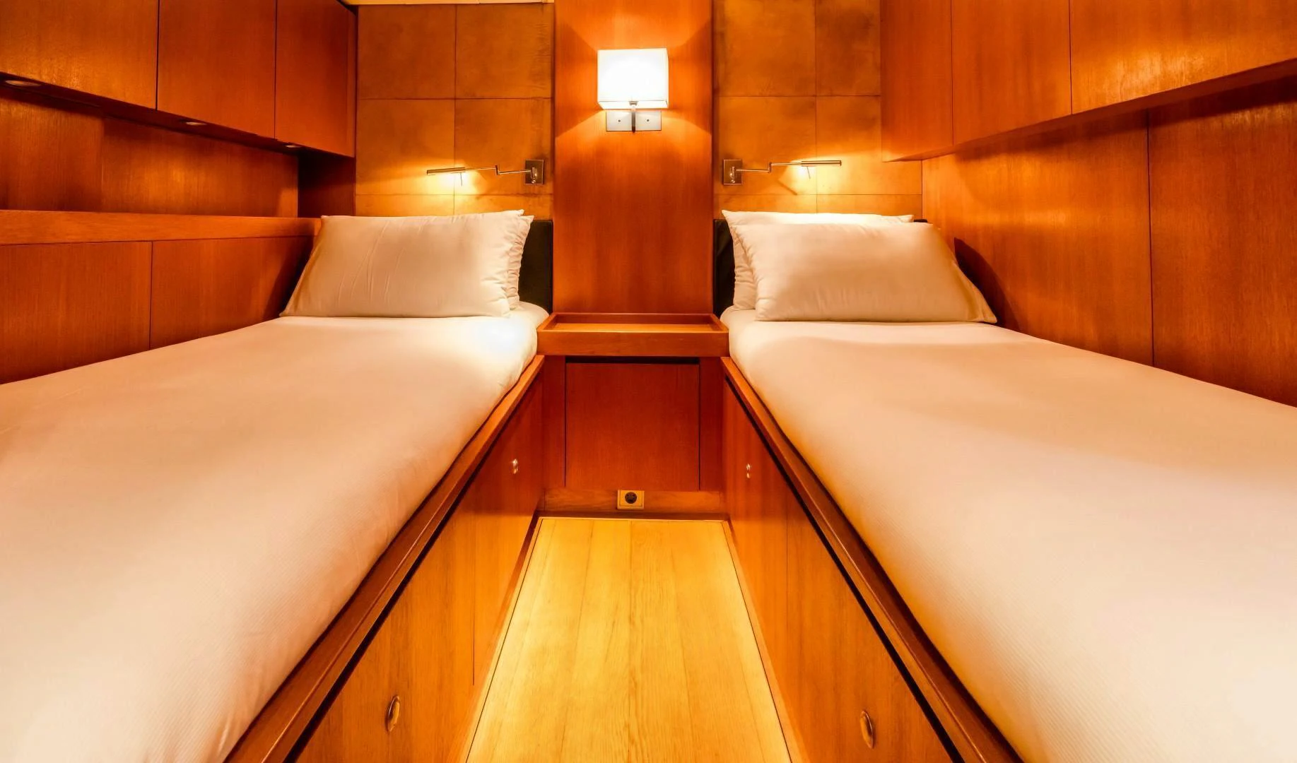 a room with wooden furniture aboard HOPPETOSSE Yacht for Sale