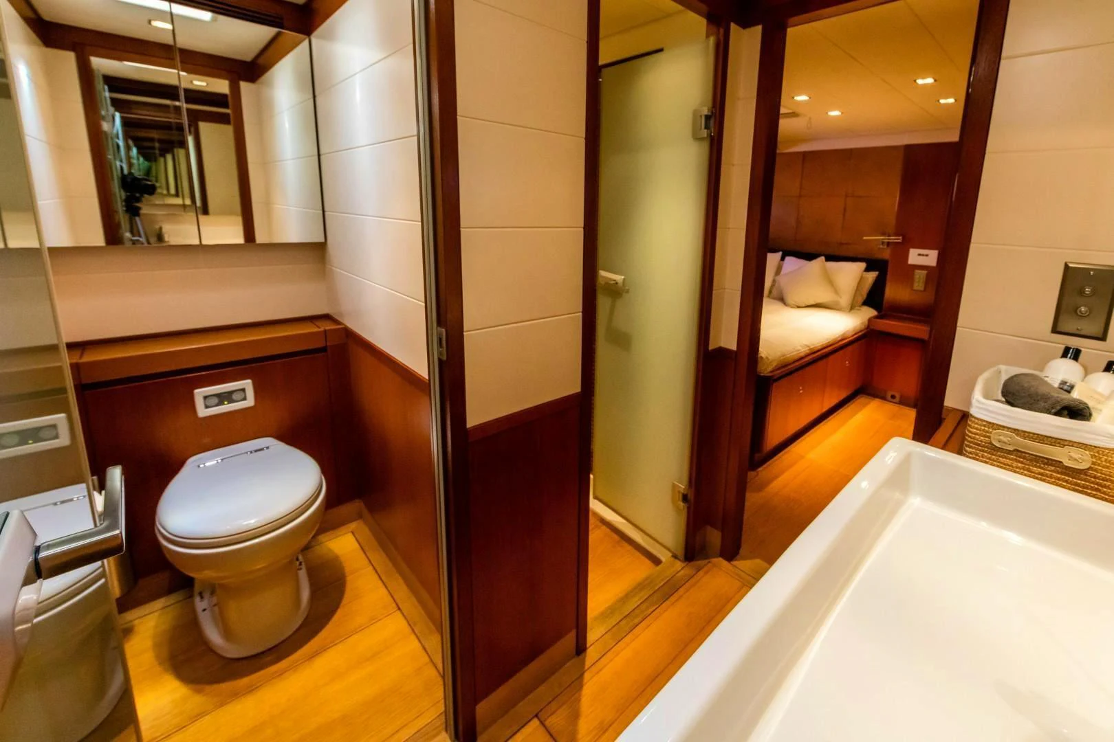 a bathroom with a toilet and a bathtub aboard HOPPETOSSE Yacht for Sale