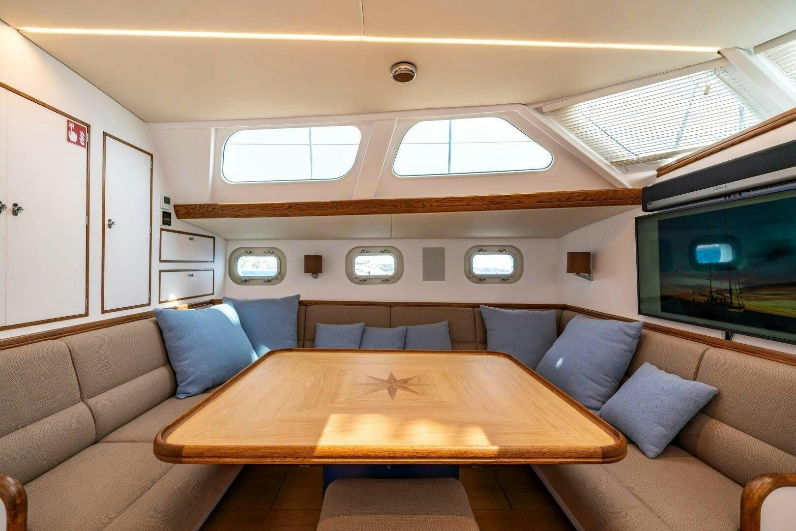 a room with a couch and a table aboard ALTAIR Yacht for Sale
