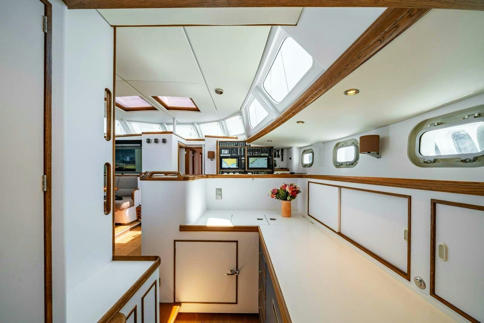 a kitchen with white cabinets aboard ALTAIR Yacht for Sale