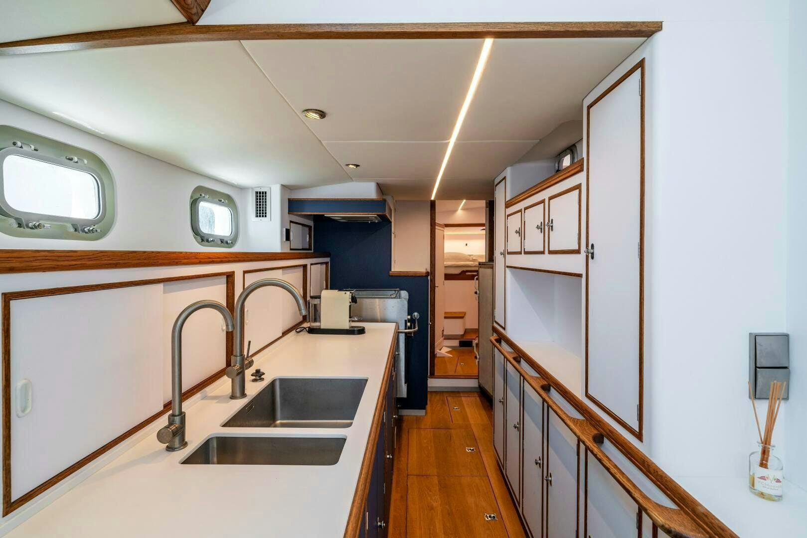 a kitchen with a sink and cabinets aboard ALTAIR Yacht for Sale