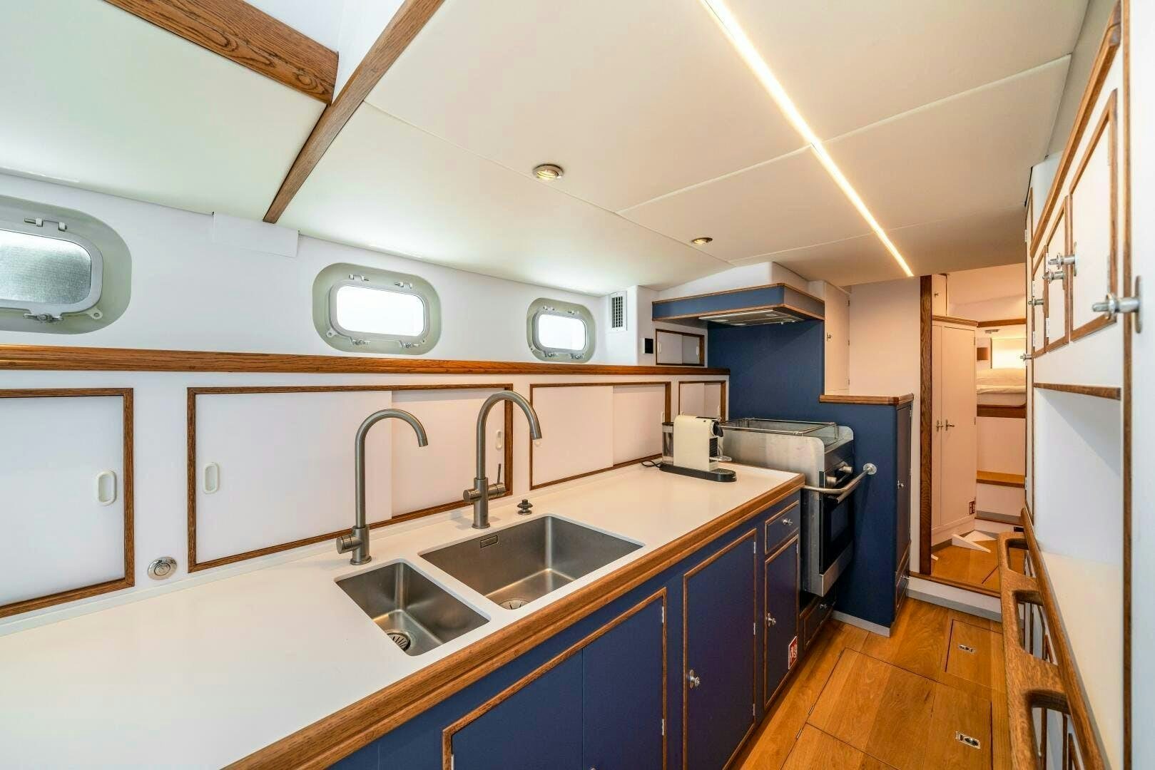 a kitchen with a sink and cabinets aboard ALTAIR Yacht for Sale