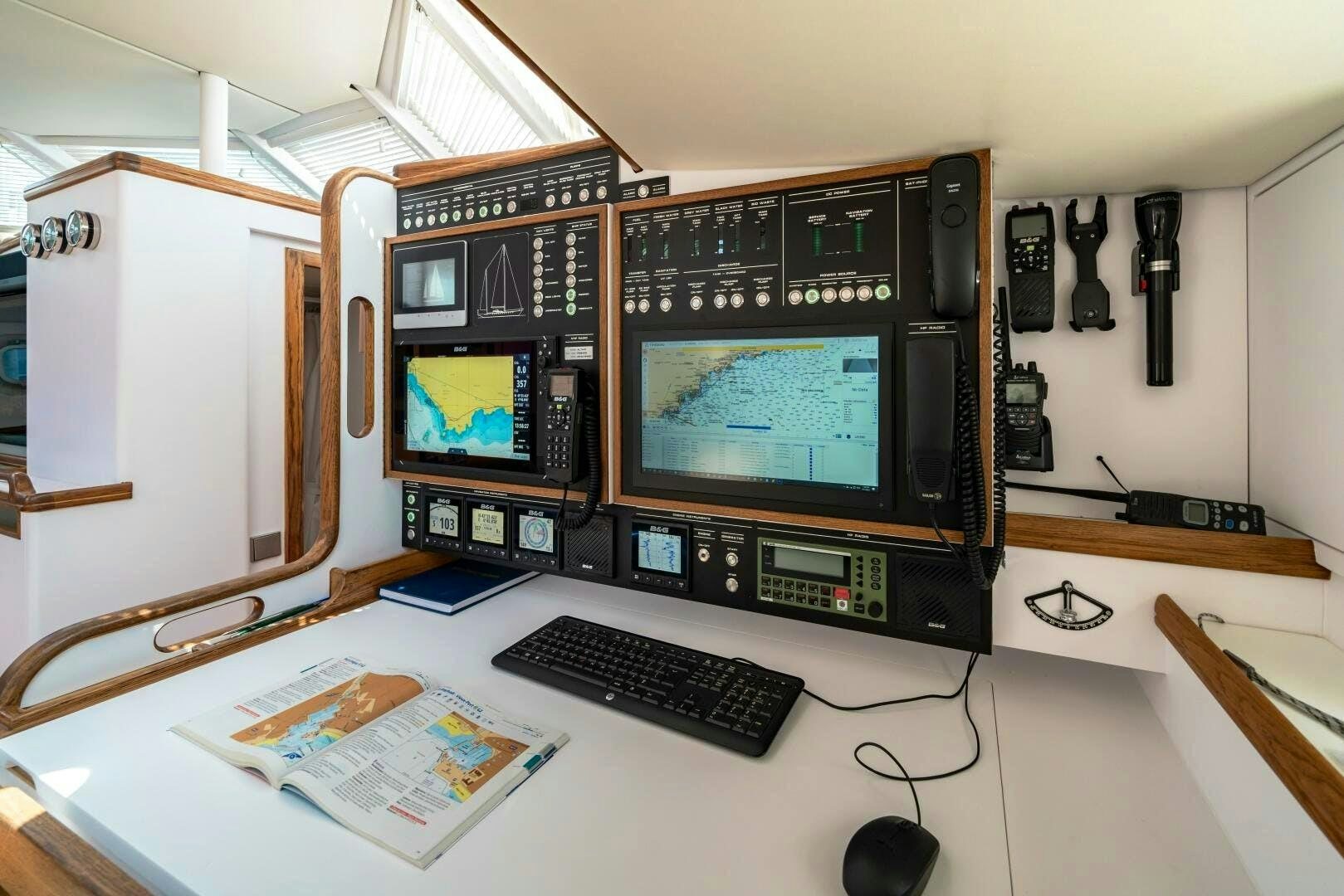 a computer on a desk aboard ALTAIR Yacht for Sale