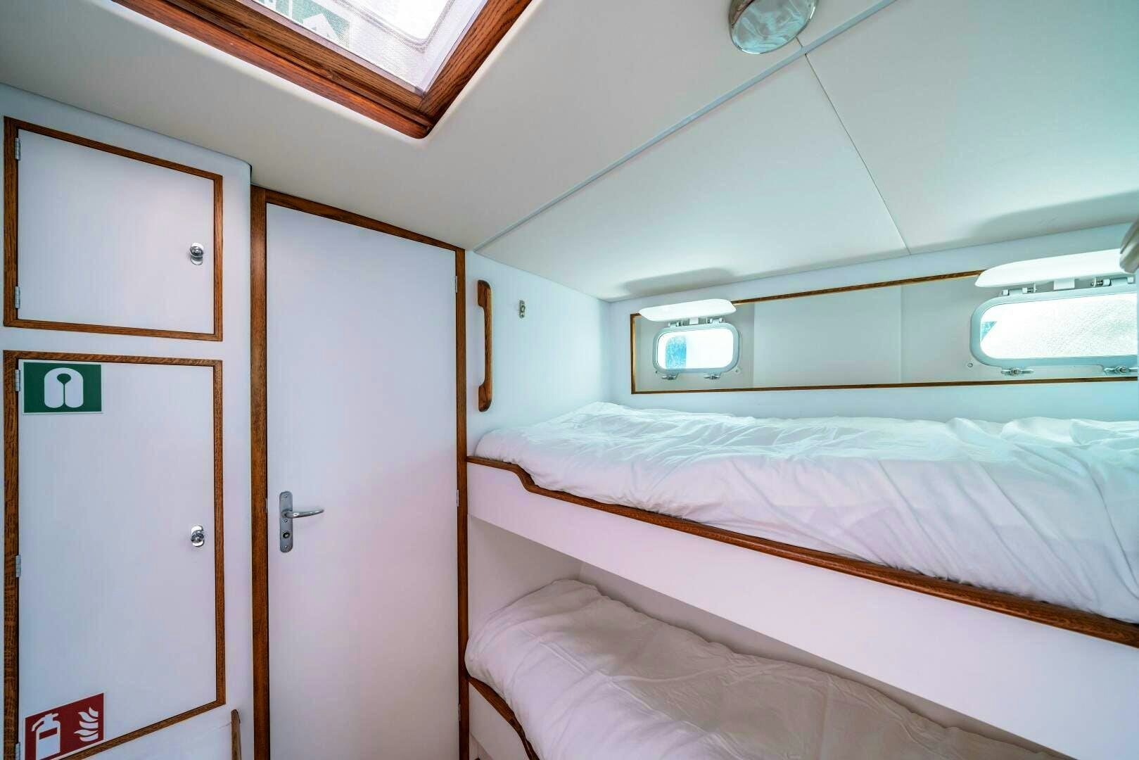 a room with two beds aboard ALTAIR Yacht for Sale