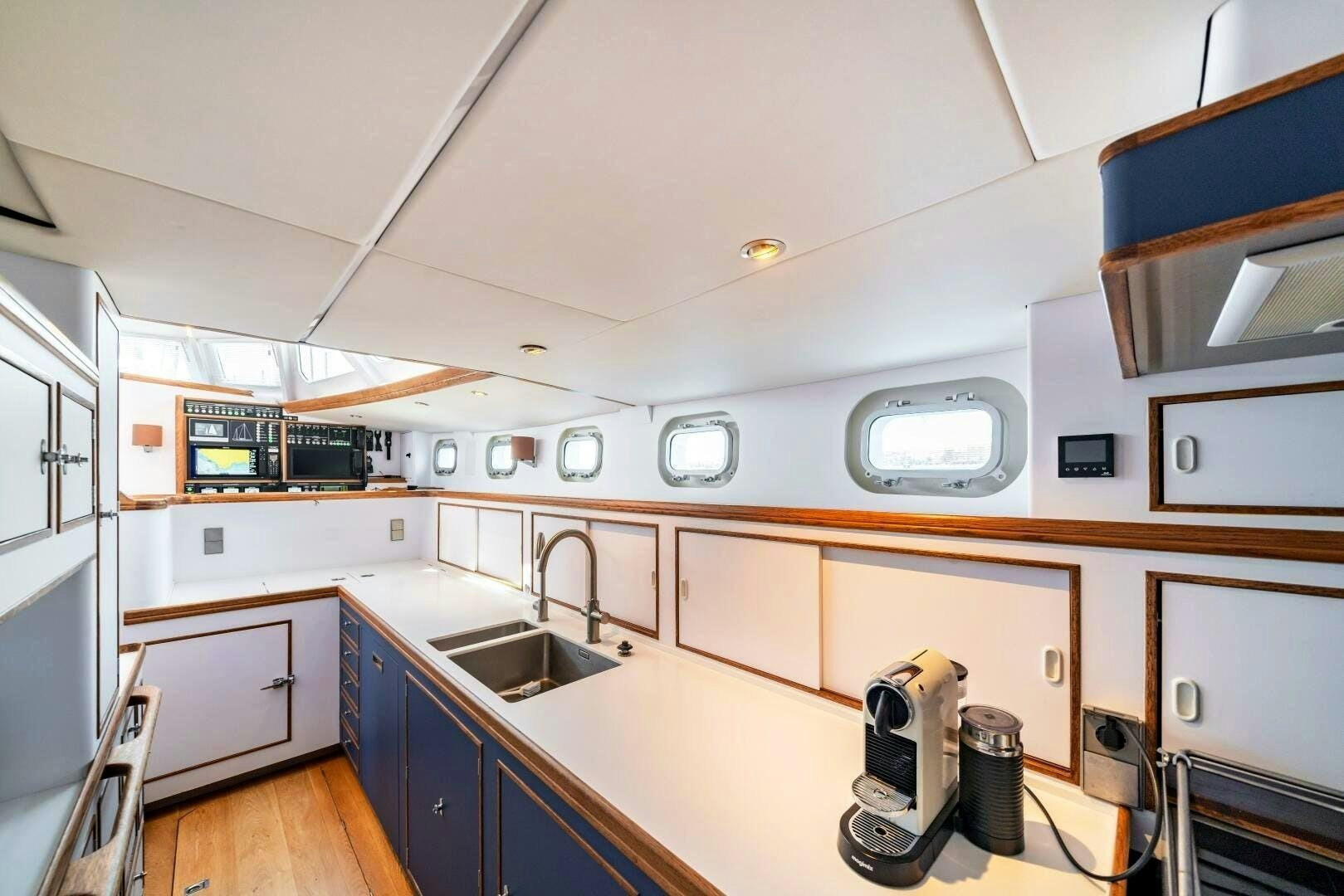 a kitchen with a sink and cabinets aboard ALTAIR Yacht for Sale