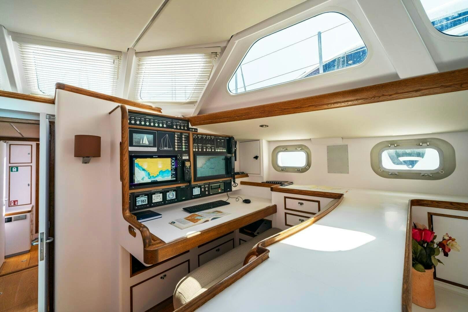 inside of a building with a desk and tv aboard ALTAIR Yacht for Sale