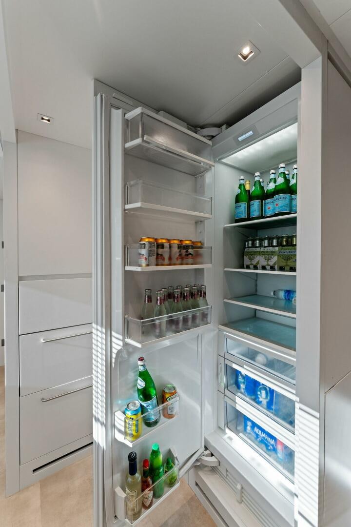 a refrigerator with a door open aboard GATSBY Yacht for Sale