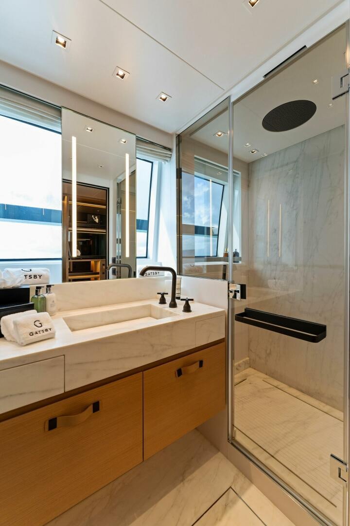 a bathroom with a large mirror aboard GATSBY Yacht for Sale