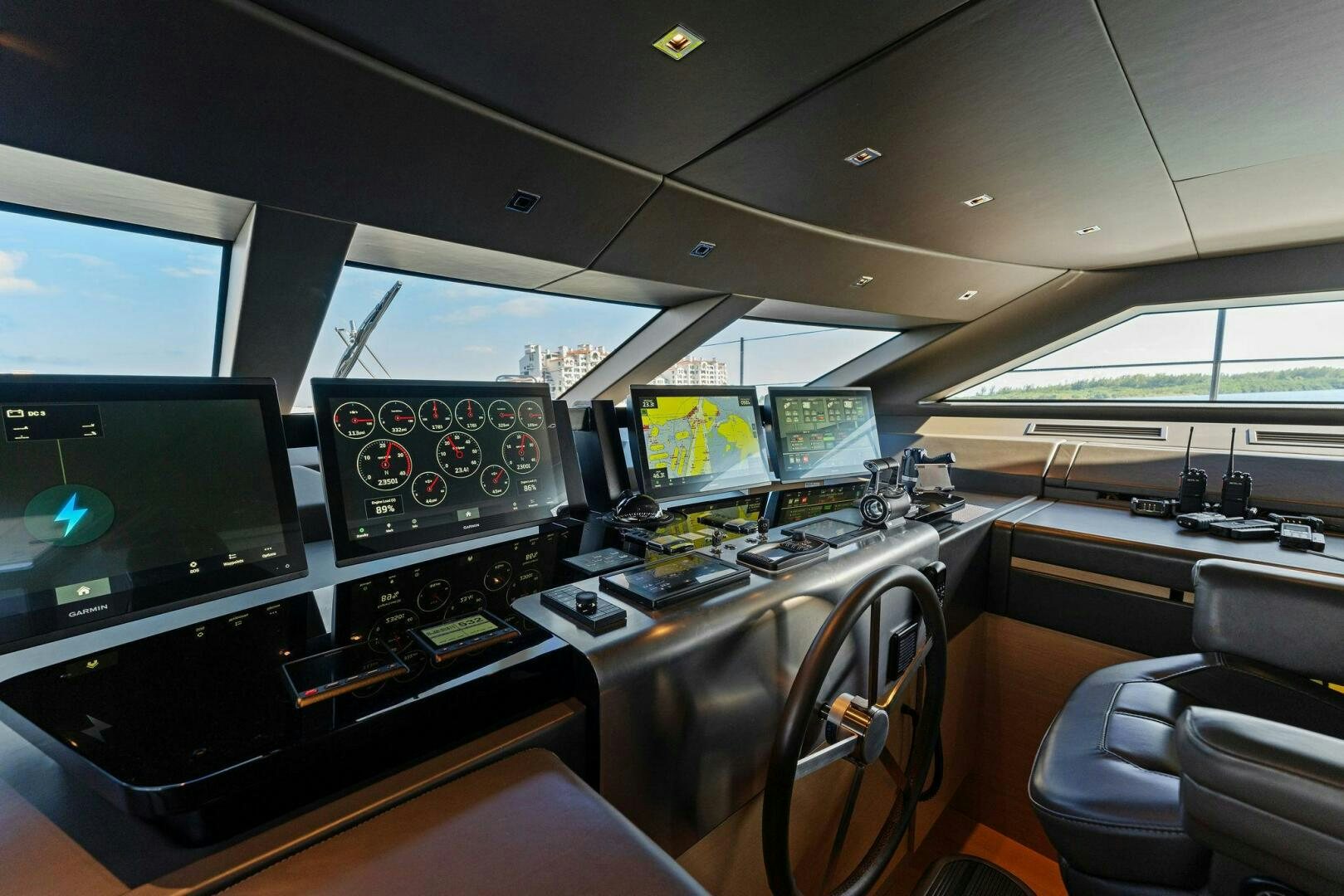a room with many monitors and computers aboard GATSBY Yacht for Sale