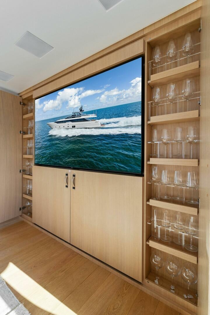 a glass wall with a glass display case and a glass display case aboard GATSBY Yacht for Sale