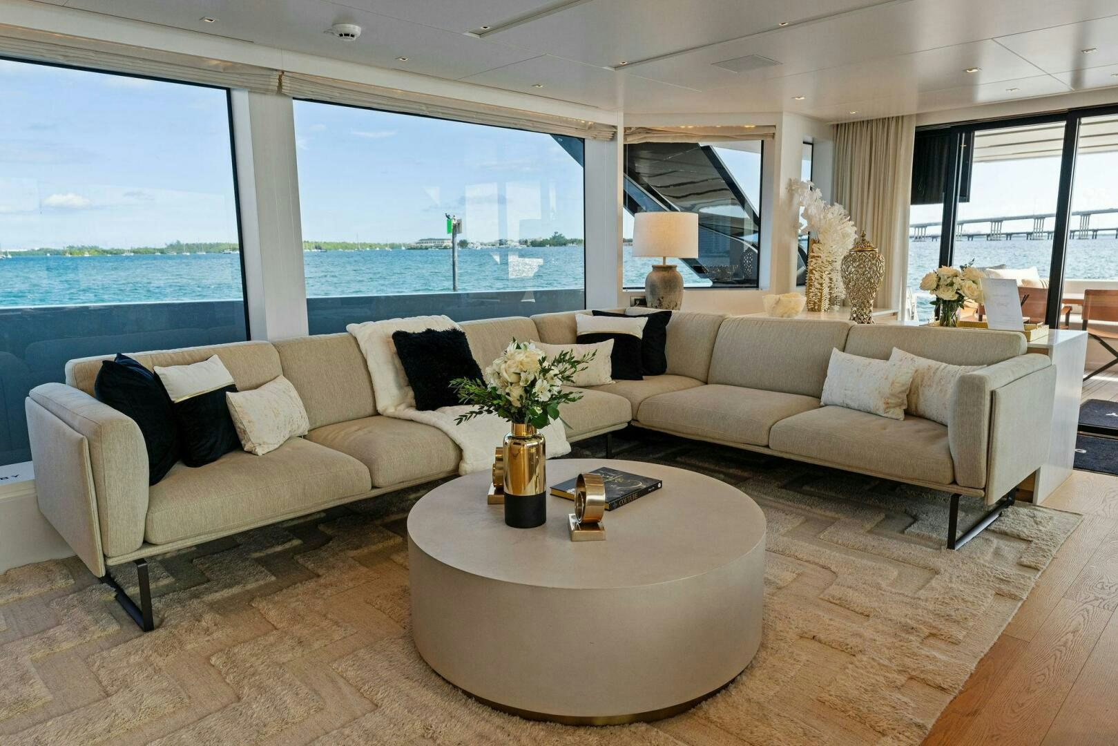 a living room with a couch and a table aboard GATSBY Yacht for Sale