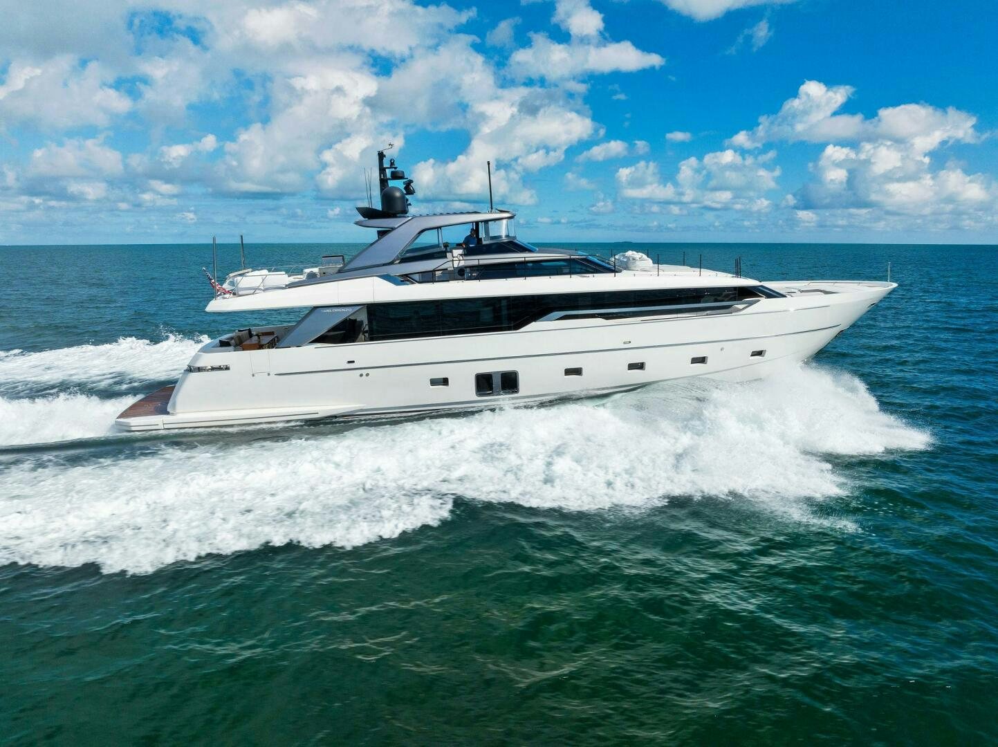 a white yacht on the water aboard GATSBY Yacht for Sale