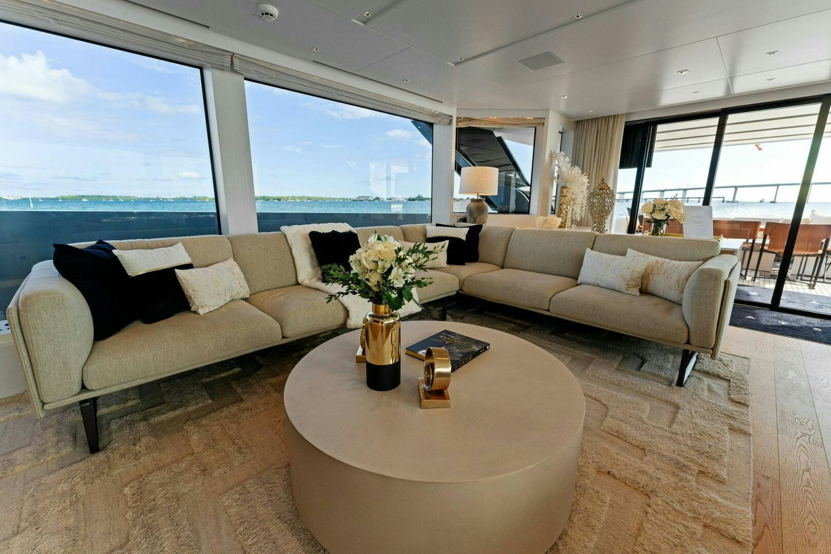 a living room with a couch and a table aboard GATSBY Yacht for Sale