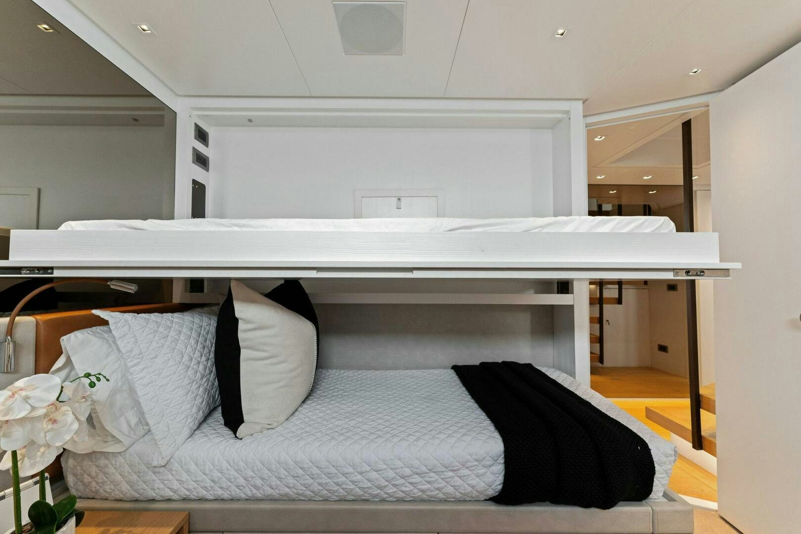 a white bunk bed with a white mattress and a white shelf aboard GATSBY Yacht for Sale