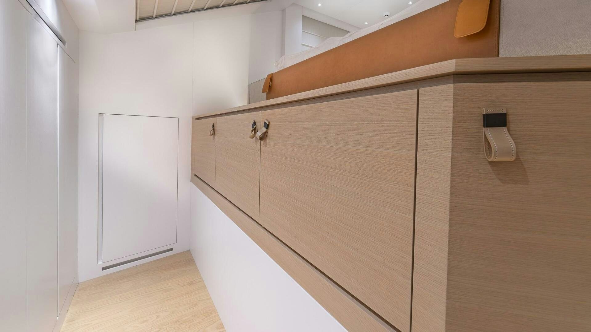 a white cabinet in a room aboard GATSBY Yacht for Sale