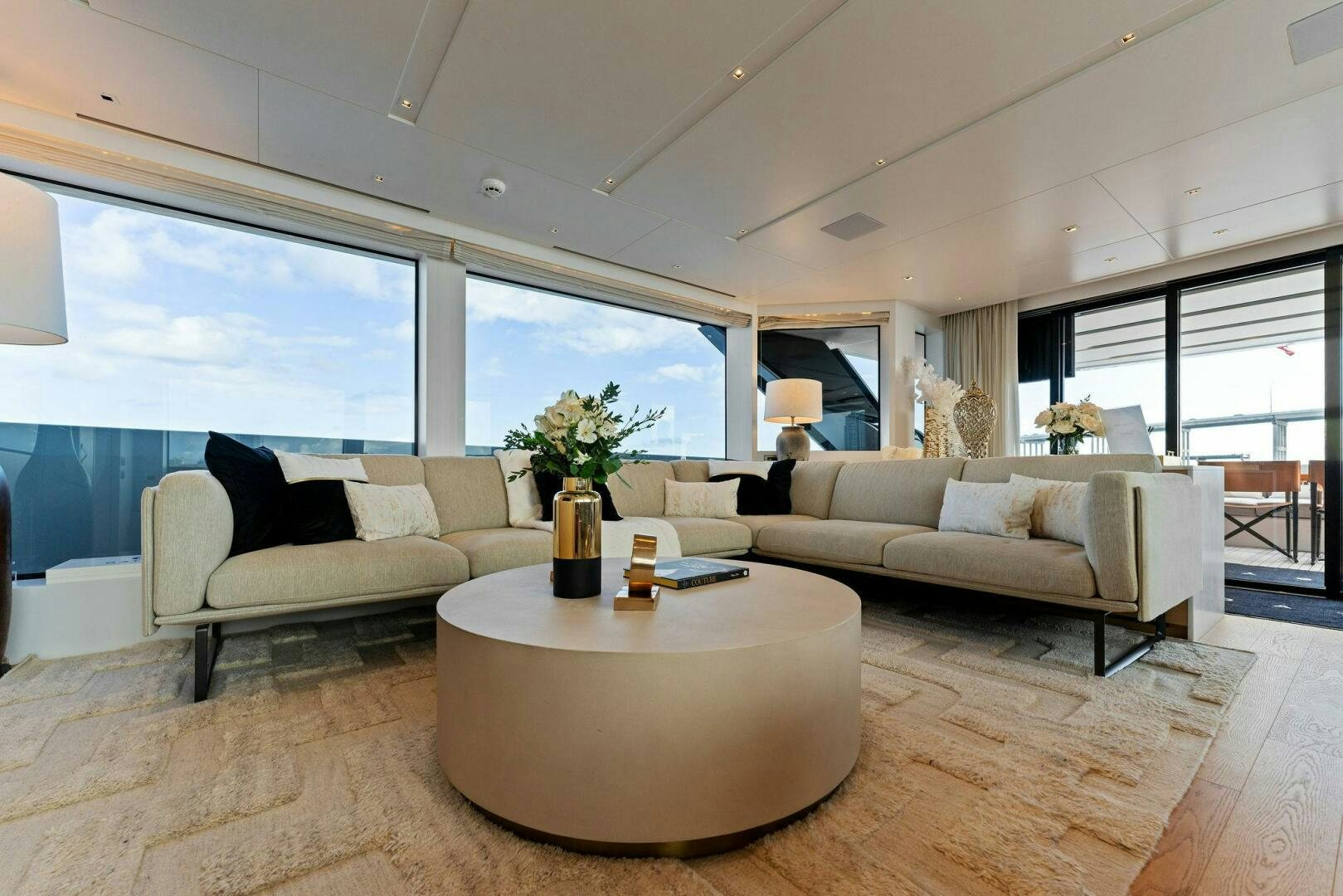 a living room with a couch and a table aboard GATSBY Yacht for Sale