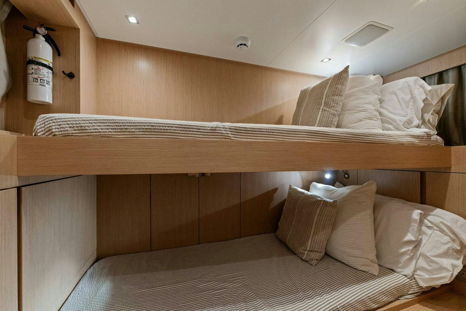 a bed with white sheets aboard GATSBY Yacht for Sale