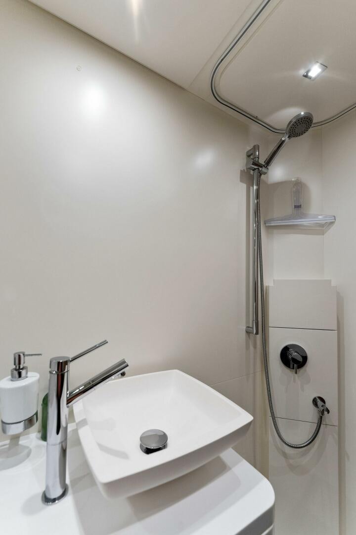 a bathroom with a sink and a shower aboard GATSBY Yacht for Sale