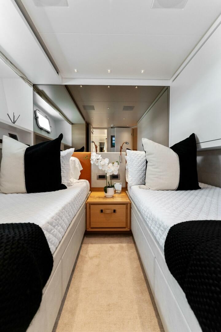 a room with two beds aboard GATSBY Yacht for Sale
