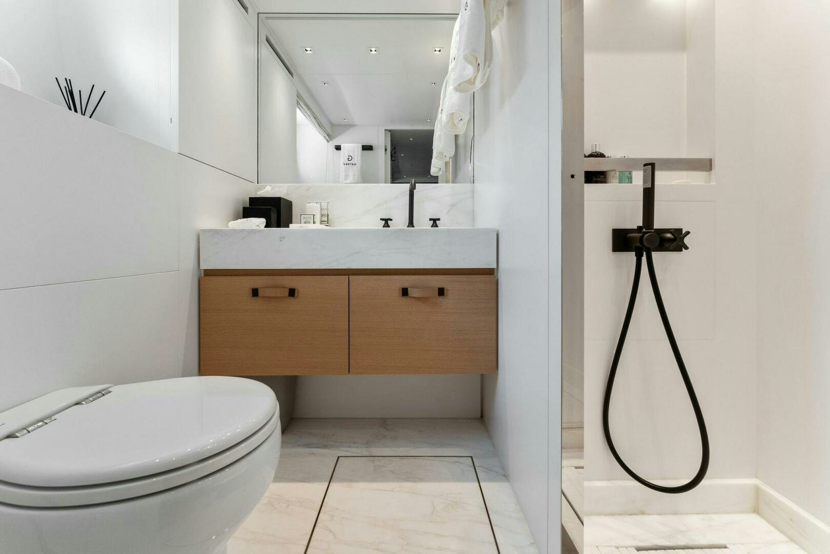 a bathroom with a sink and toilet aboard GATSBY Yacht for Sale