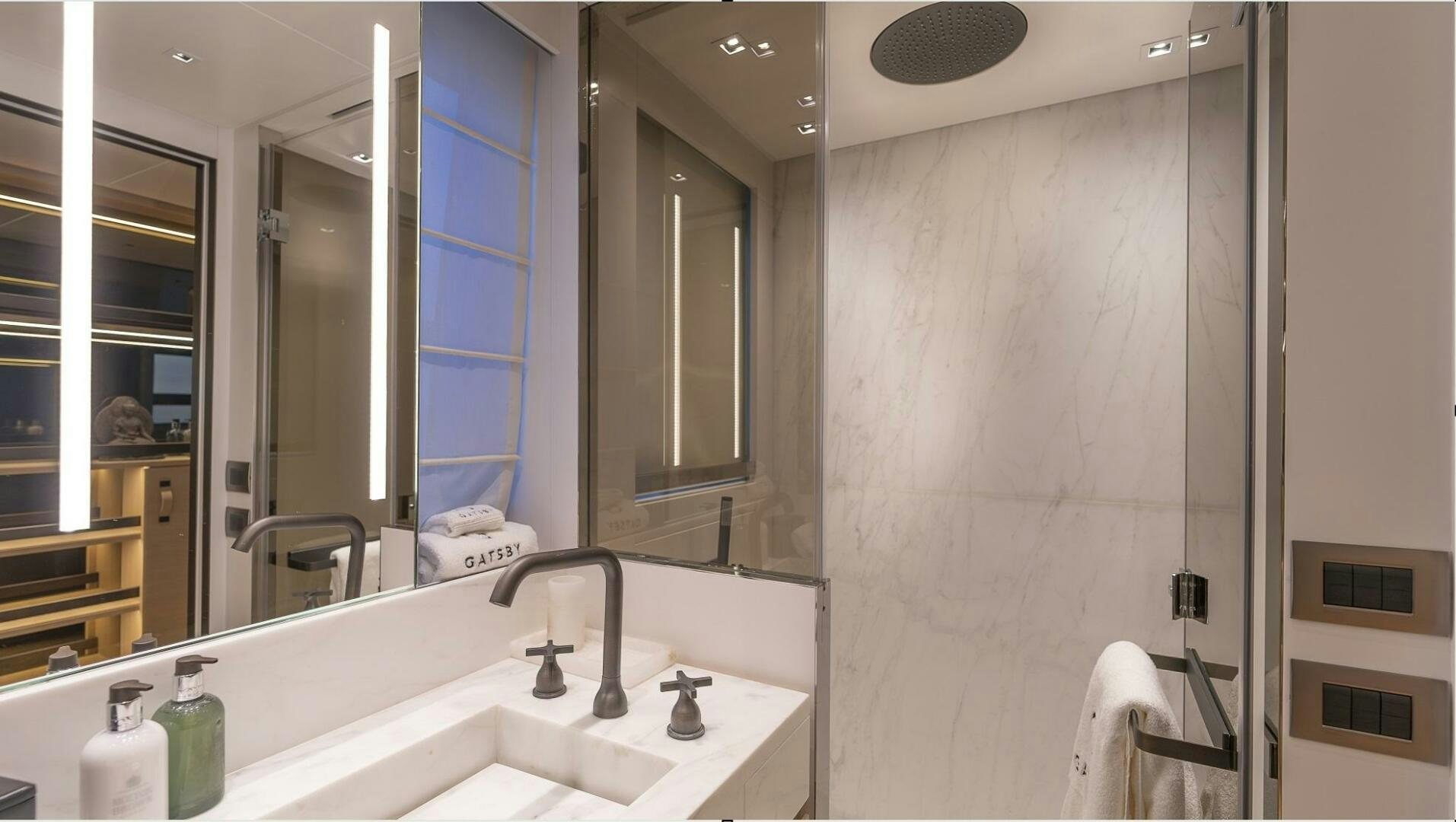 a bathroom with a large mirror aboard GATSBY Yacht for Sale