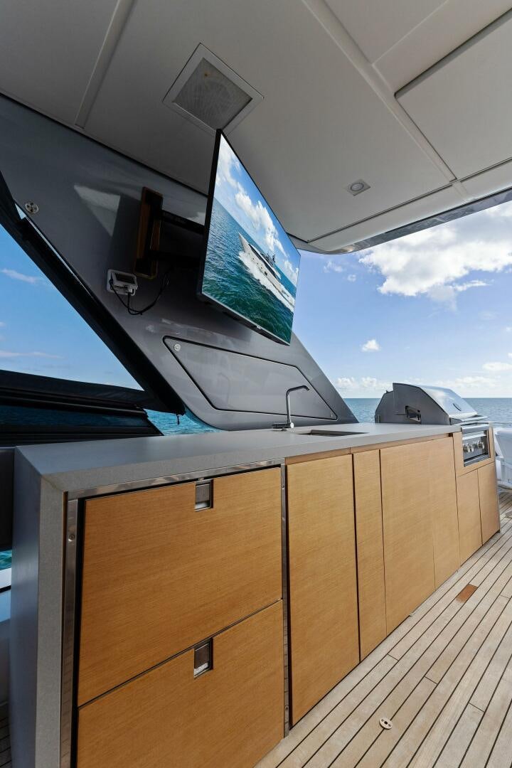 a wooden platform with a tv on it aboard GATSBY Yacht for Sale