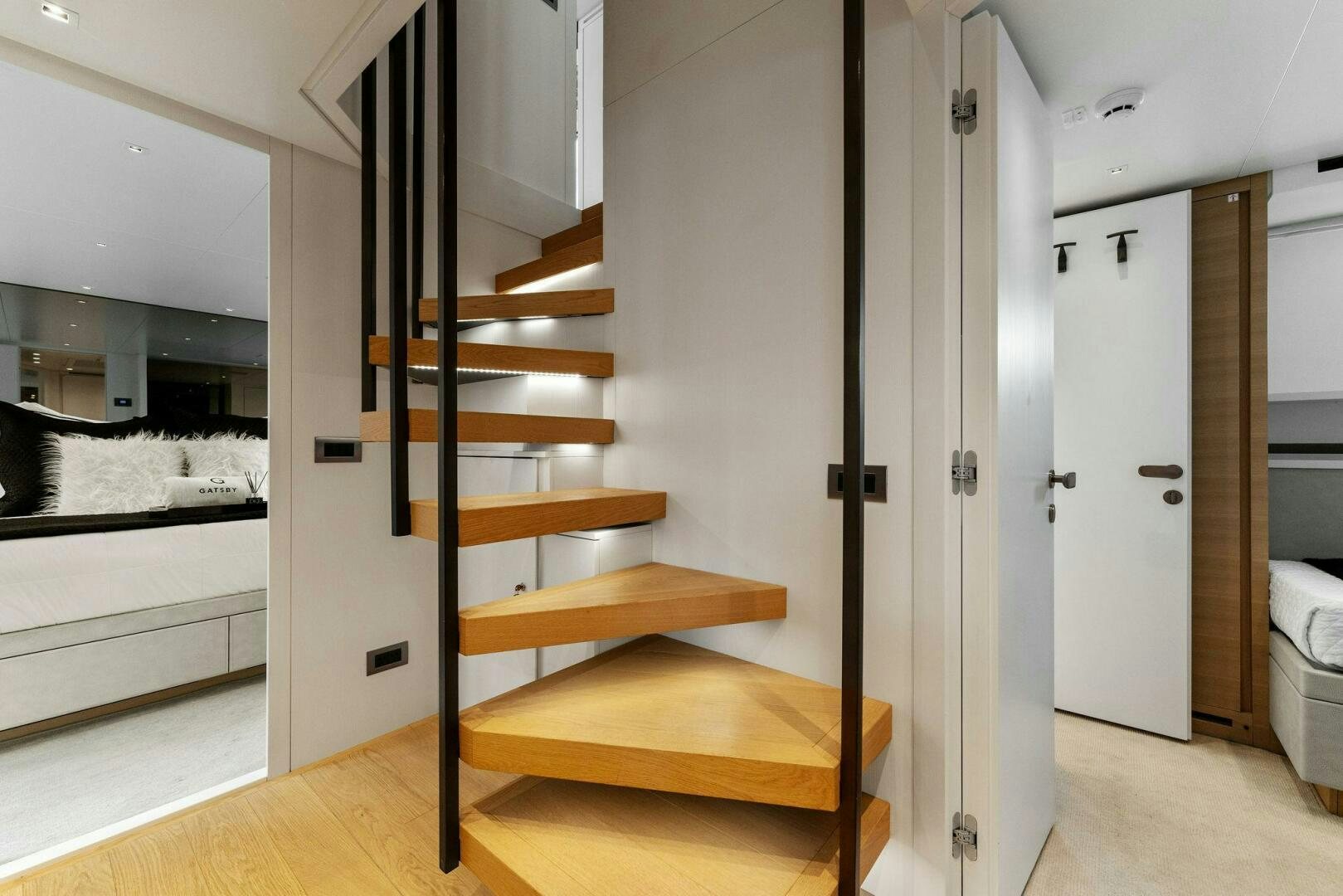 a wooden staircase in a room aboard GATSBY Yacht for Sale