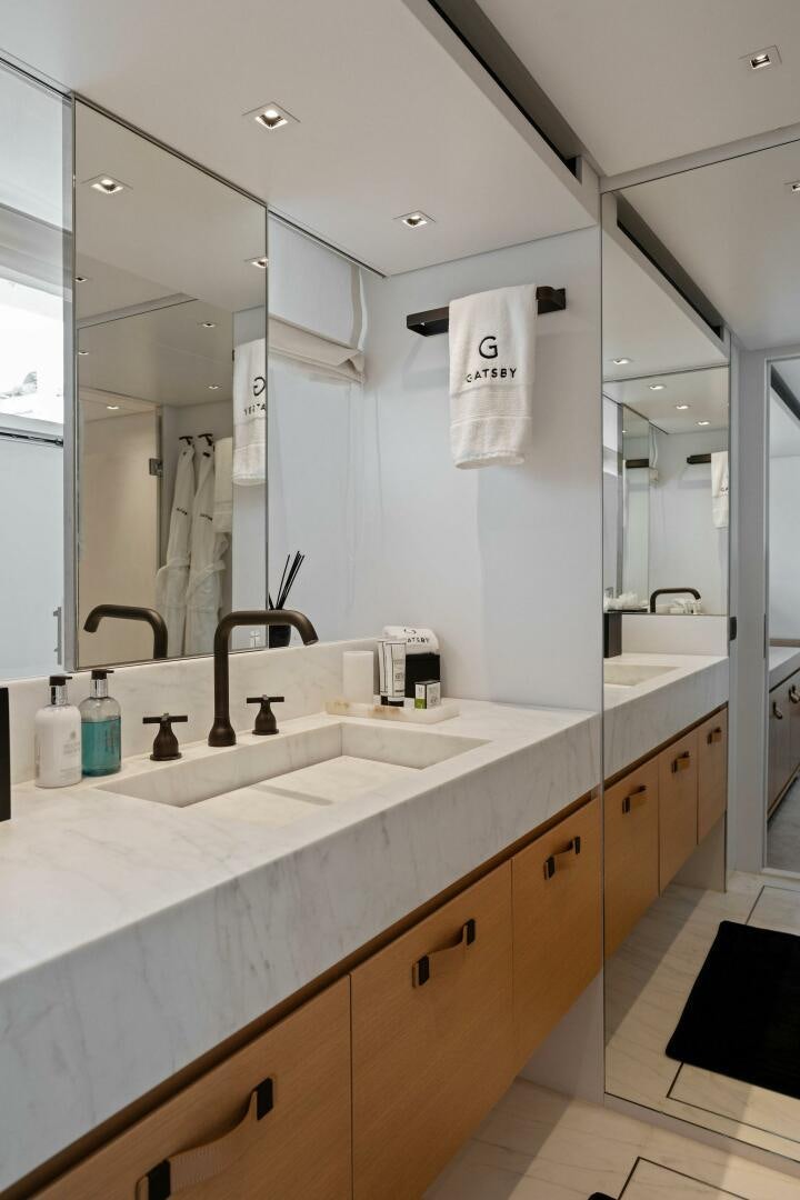 a bathroom with a large mirror aboard GATSBY Yacht for Sale