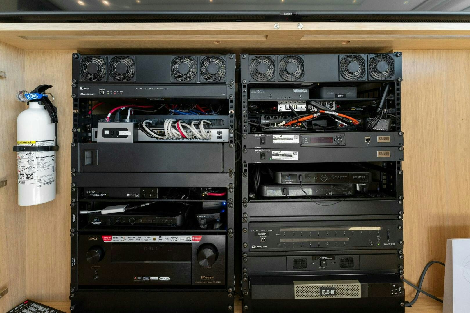 a cabinet with various electronics aboard GATSBY Yacht for Sale