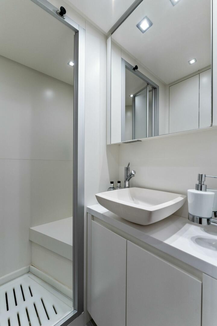 a bathroom with a sink and a mirror aboard GATSBY Yacht for Sale
