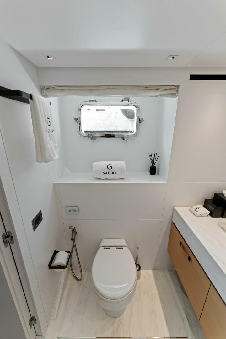 a small white bathroom aboard GATSBY Yacht for Sale