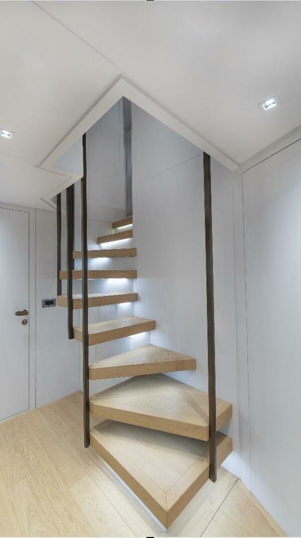 a wooden staircase in a house aboard GATSBY Yacht for Sale