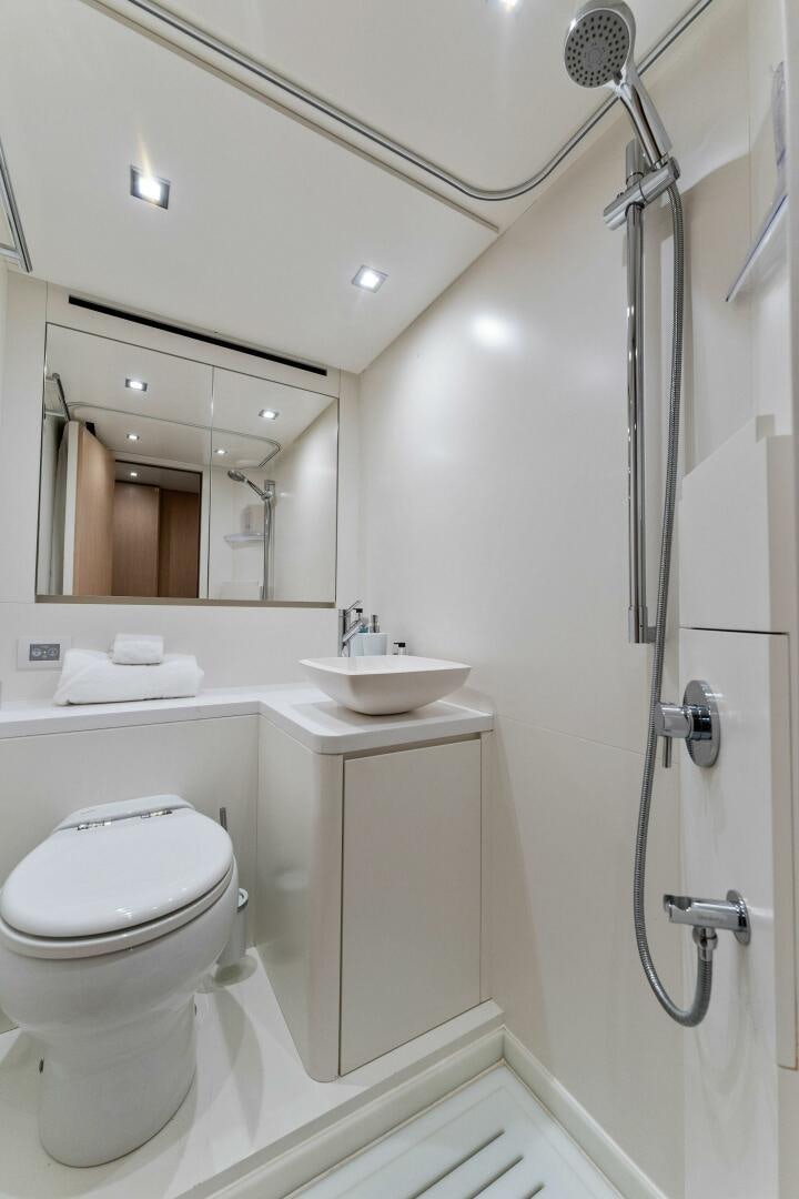 a bathroom with a toilet and sink aboard GATSBY Yacht for Sale