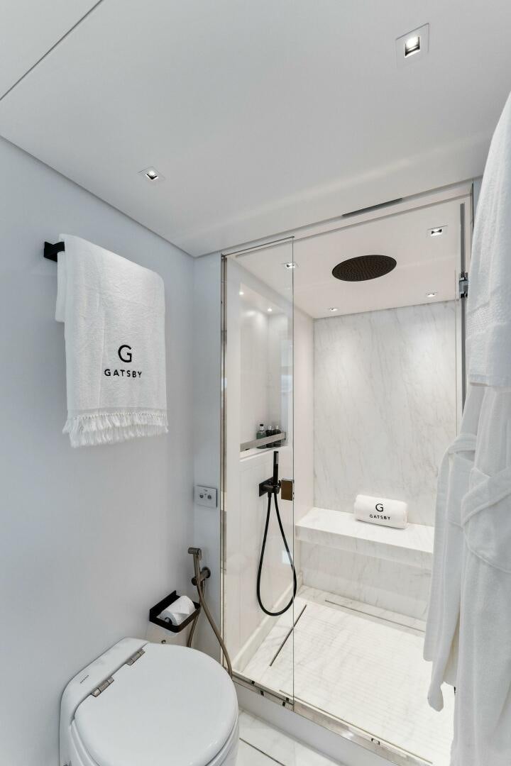 a bathroom with a shower unit aboard GATSBY Yacht for Sale