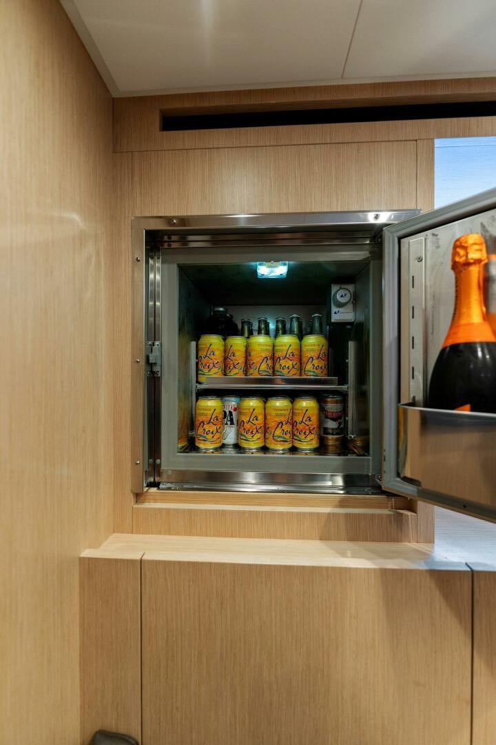 a refrigerator with a lot of food in it aboard GATSBY Yacht for Sale