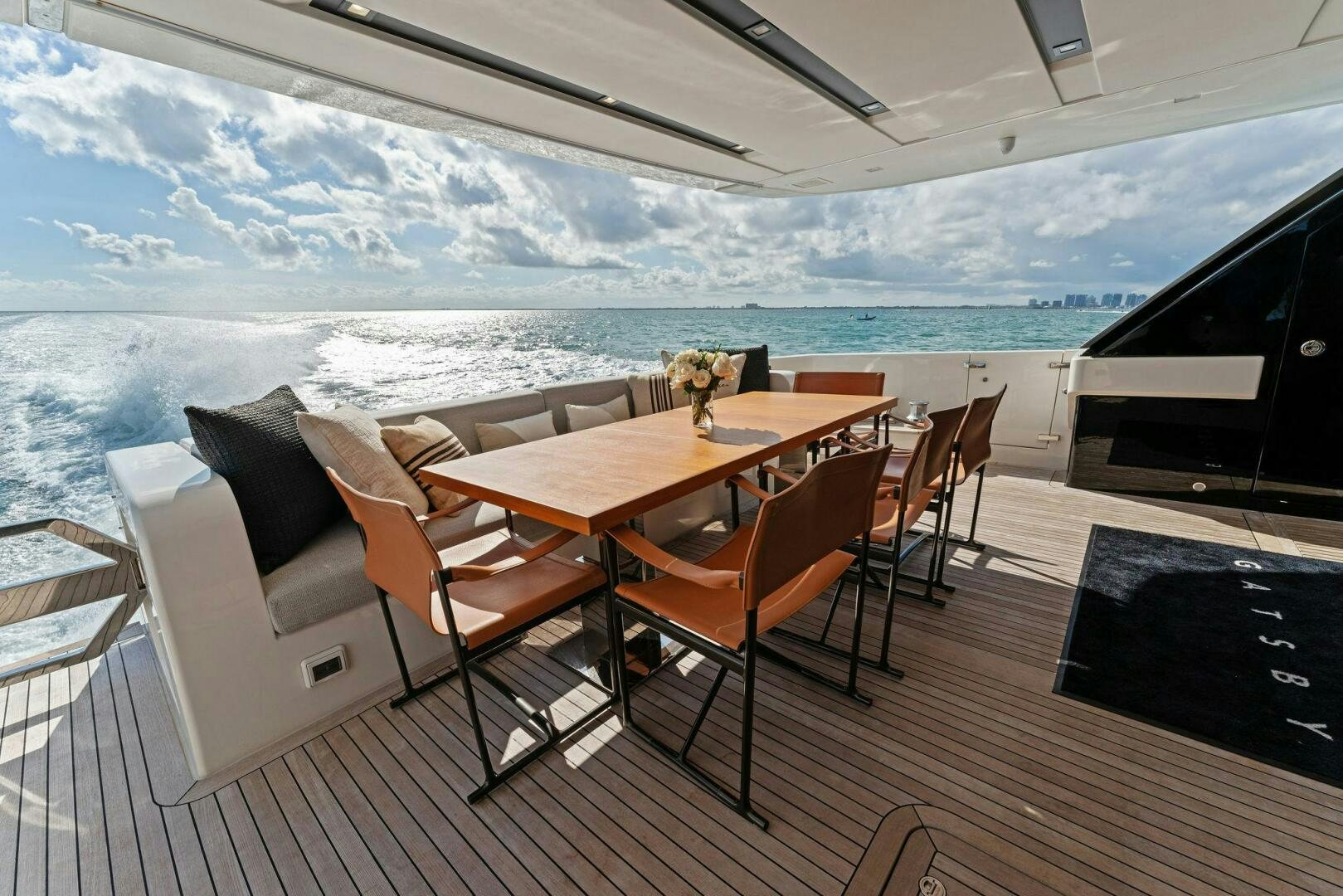 a room with a table and chairs aboard GATSBY Yacht for Sale