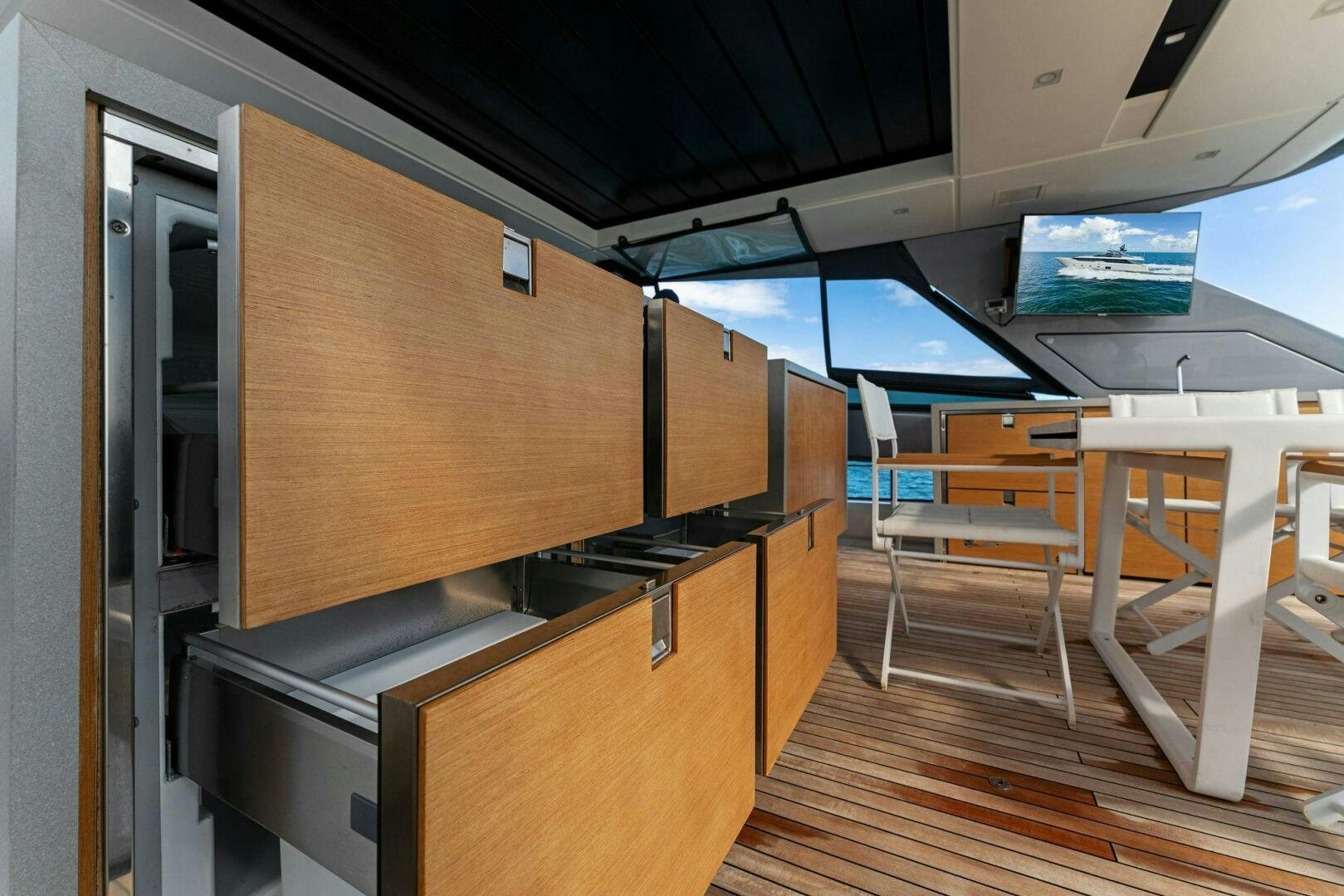 a room with a desk and chairs aboard GATSBY Yacht for Sale