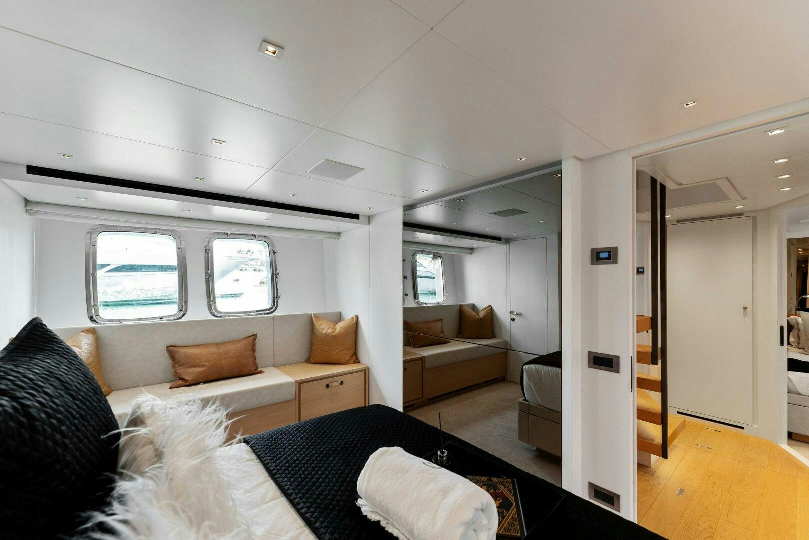 a living room with a couch and a door aboard GATSBY Yacht for Sale