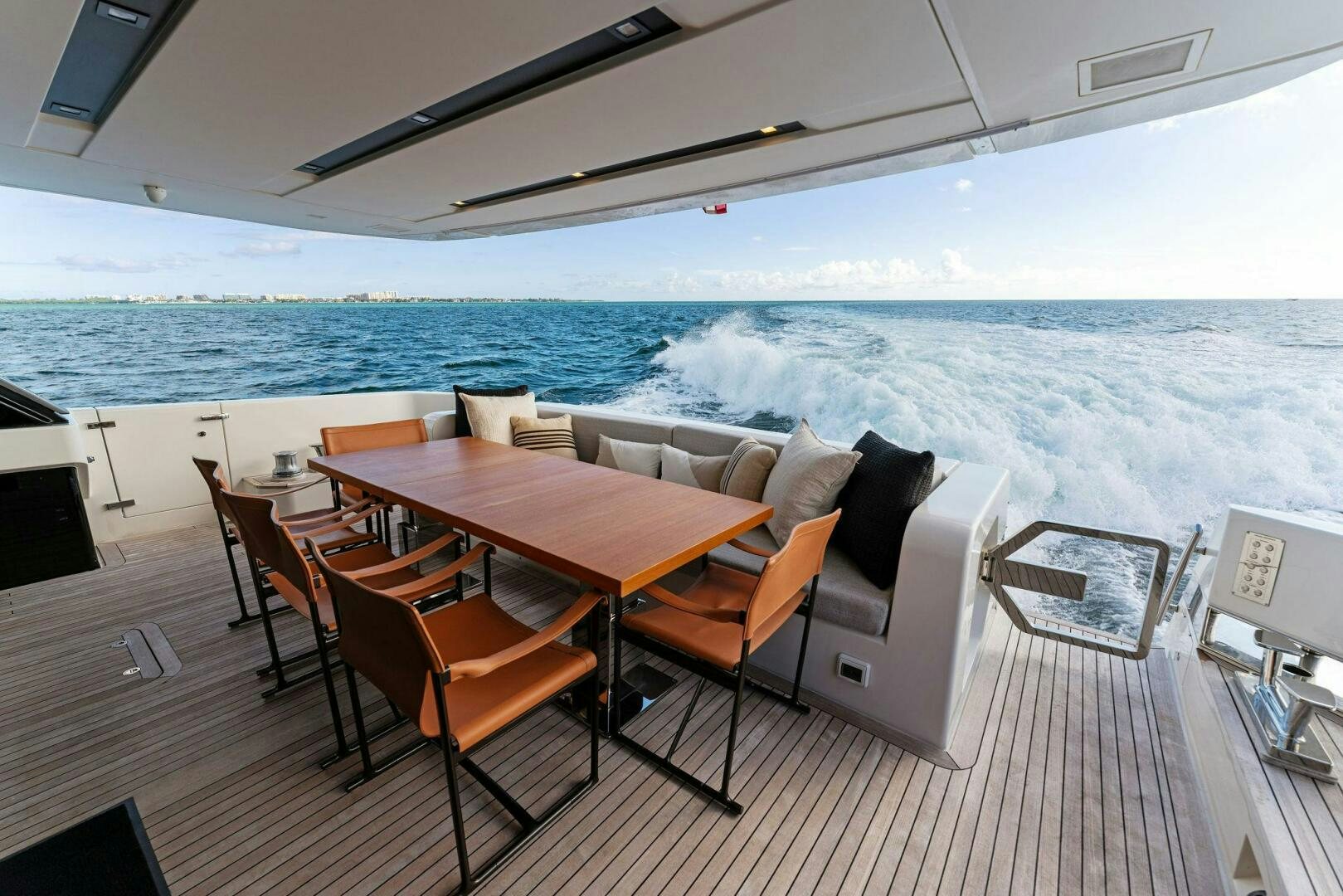 a room with a table and chairs aboard GATSBY Yacht for Sale