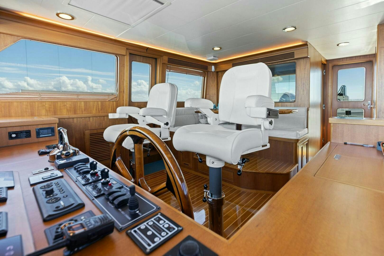 a room with a table chairs and a machine on the table aboard SUNZSET Yacht for Sale