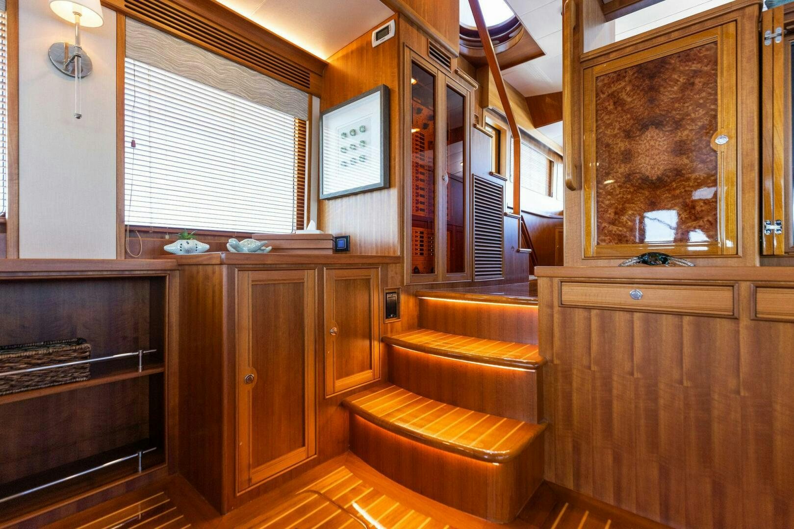 a kitchen with wooden cabinets aboard SUNZSET Yacht for Sale