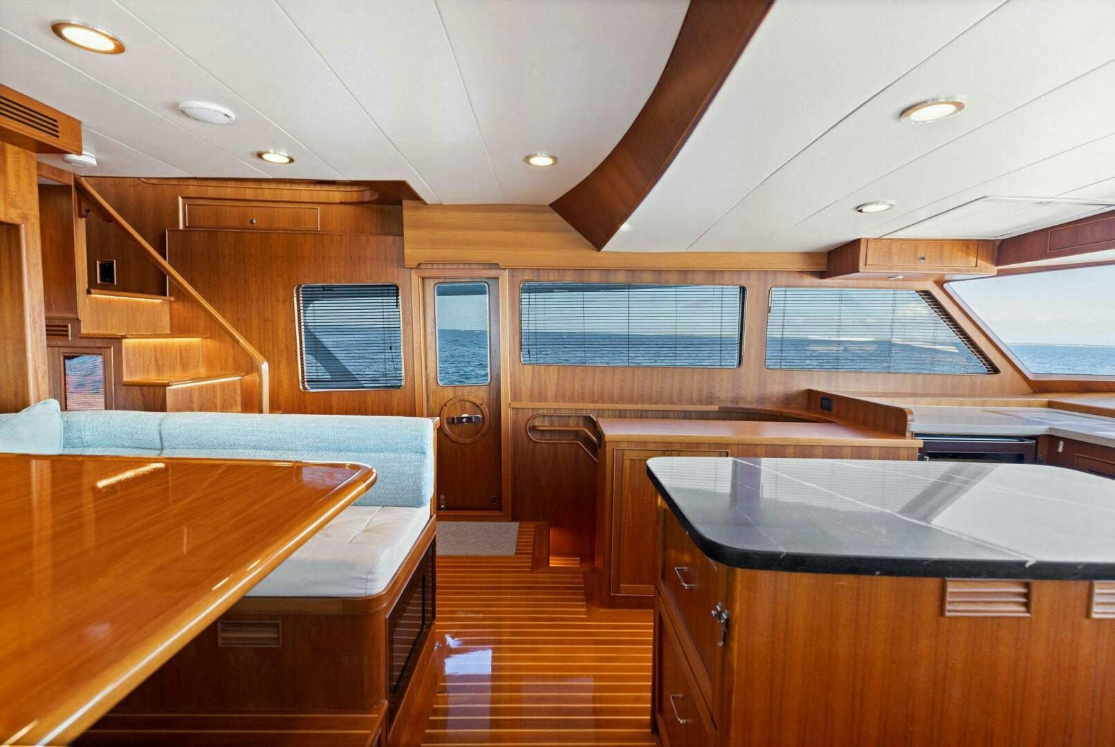 a room with wooden cabinets and a wood floor aboard SUNZSET Yacht for Sale
