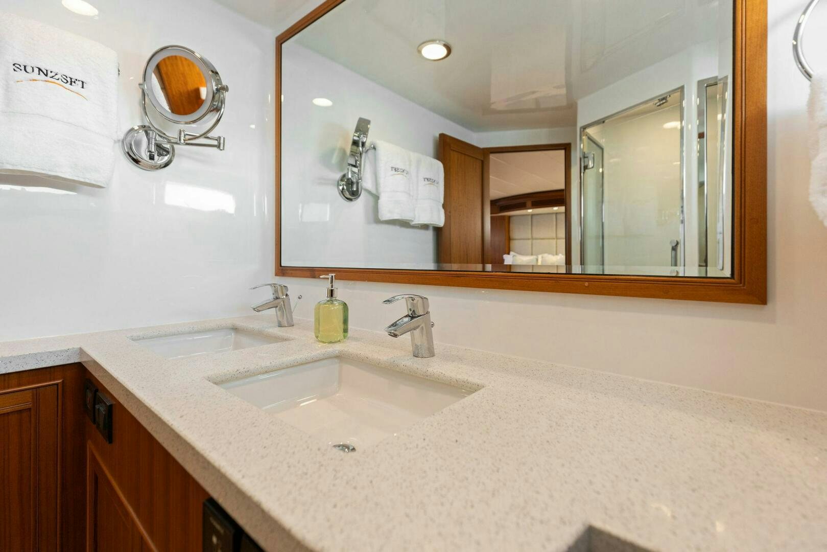 a bathroom with a large mirror aboard SUNZSET Yacht for Sale