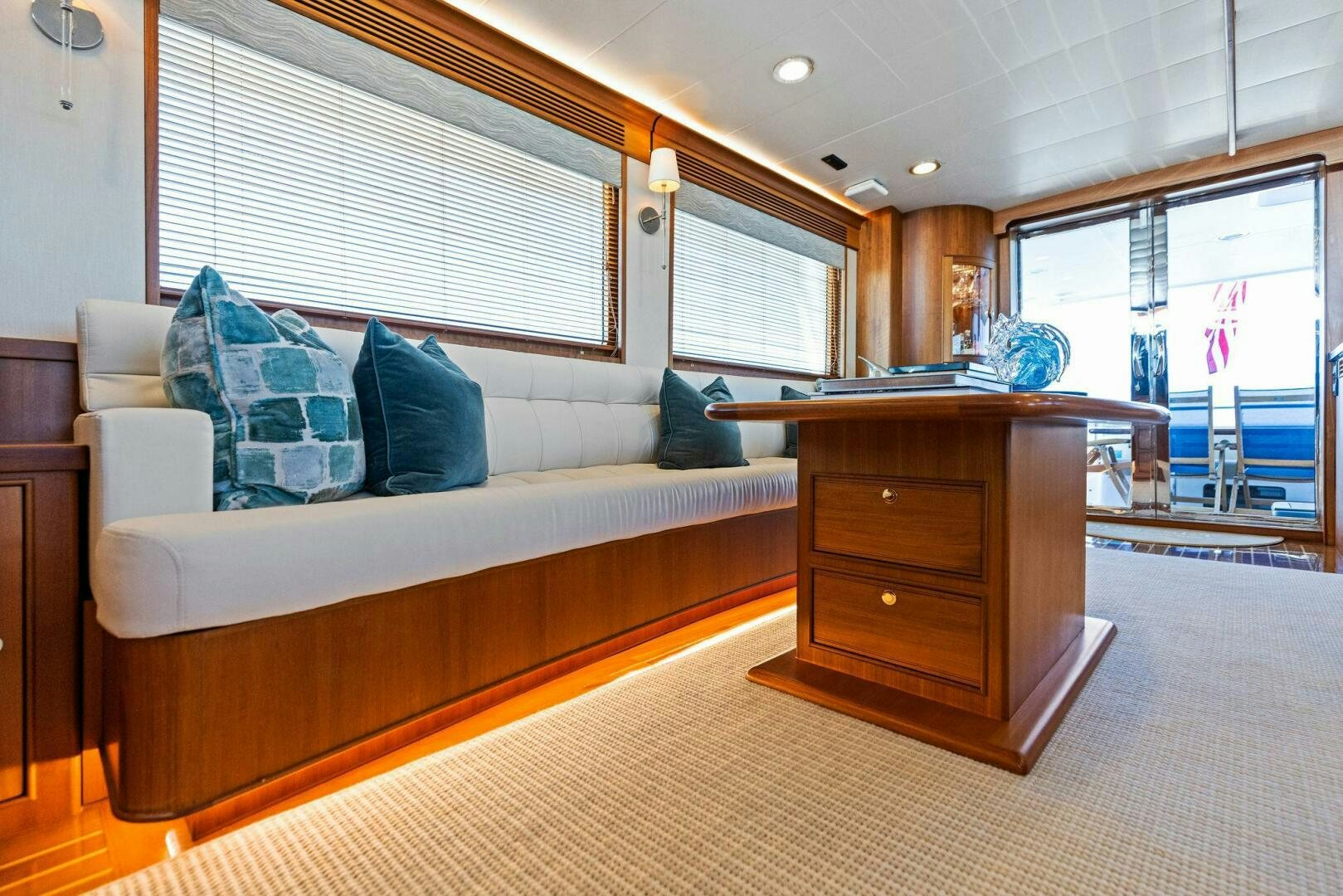 a living room with a couch and a piano aboard SUNZSET Yacht for Sale
