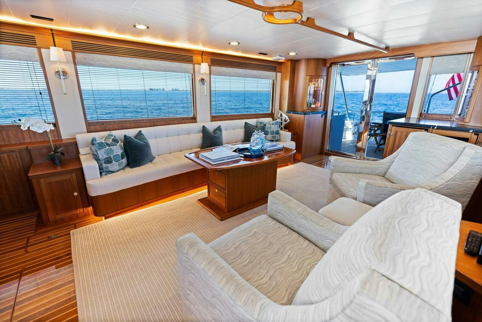 a living room with a large window aboard SUNZSET Yacht for Sale