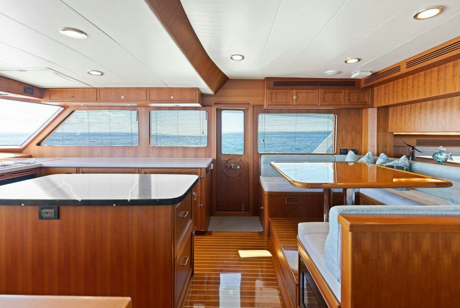 a room with wooden cabinets and a wood floor aboard SUNZSET Yacht for Sale