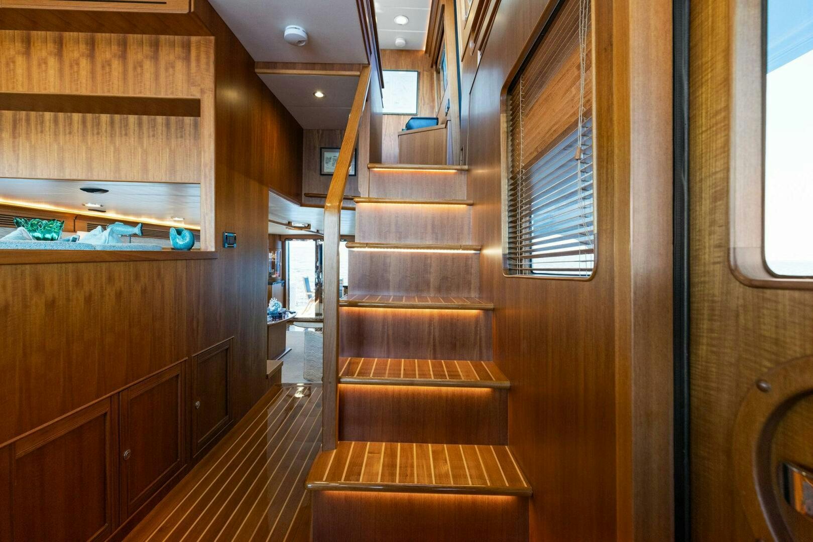 a wooden staircase in a room aboard SUNZSET Yacht for Sale