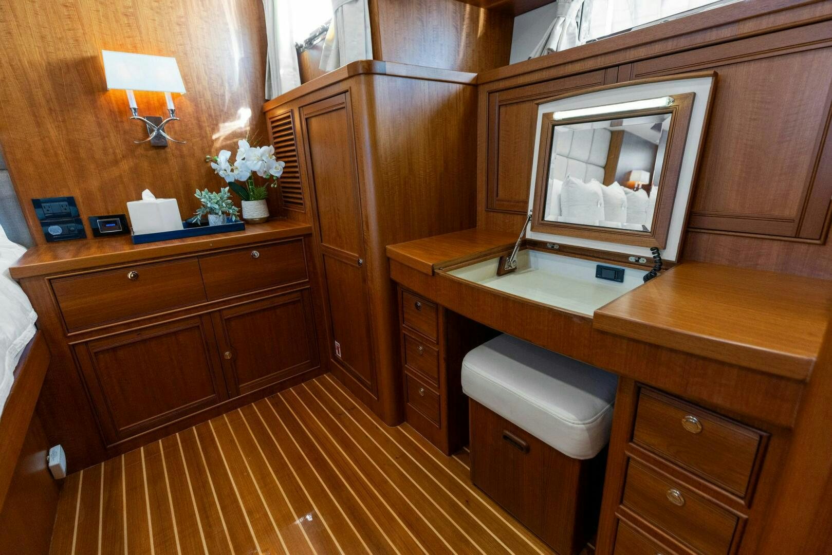 a bathroom with wooden cabinets aboard SUNZSET Yacht for Sale